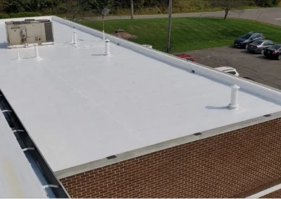 Metal commercial roofing project completed by Top Notch Roofing in Columbus, Ohio showing restored surface and sealed seams.