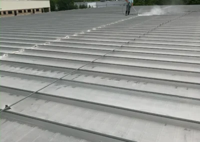 Top Notch Commercial Roofing applying protective coating to a commercial roof in Columbus, Ohio for long-term waterproofing and UV resistance.