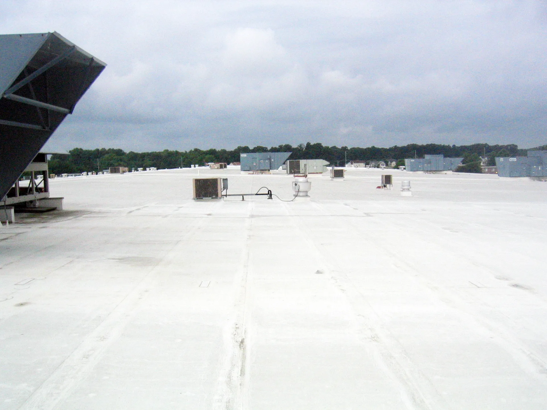 Top Notch roofing crew performing commercial roof repair work in Columbus, Ohio to fix leaks and restore structural integrity.